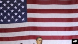 President Barack Obama speaks to troops at a rally during an unannounced visit at Bagram Air Field in Afghanistan, Dec. 3, 2010