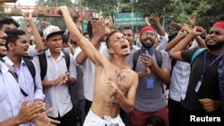 Students shout slogans as they take part in a protest over recent traffic accidents that killed two students, in Dhaka, Bangladesh, Aug. 4, 2018. 