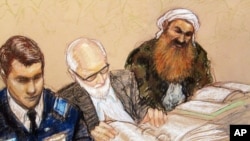 FILE - A sketch by a courtroom artist shows alleged 9/11 mastermind Khalid Sheikh Mohammed, right, during a pretrial hearing at the Guantanamo Bay Naval Base in Cuba, Feb. 12, 2013.