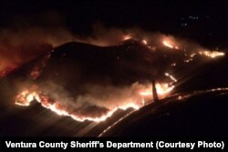 An aerial photo taken by the Ventura County Sheriff's Department shows the brush fire that broke out late Friday near U.S. Highway 101 south of Carpinteria, Calif.