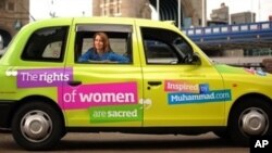 Television presenter Kristiane Becker poses for photographers in a London taxi bearing a message aimed at raising the public understanding of the Islam faith, during a photocall in London, 07 Jun 2010