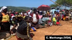 Machongwe villagers from Chimanimani district wait for food relief, March 26, 2019.