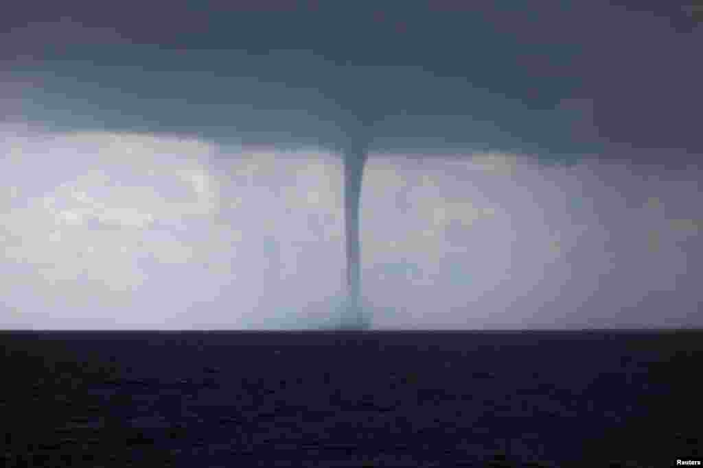 A waterspout is formed during a storm in the Mediterranean Sea.