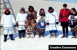 A group of Inuit in traditional dress pose during a ceremony on the occasion of the foundation of Nunavut, the homeland of the Inuit people of northern Canada, April 1, 1999.