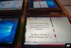 A monitor in the House of Representatives displays a schedule update on Capitol Hill in Washington, Dec. 28, 2018.