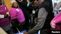 Archbishop Emeritus Desmond Tutu casts his vote during the local government elections in Milnerton, Cape Town, South Africa, Aug. 3, 2016.