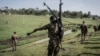 FILE - An Ethiopian National Defense Forces (ENDF) soldier carries a DShK 1938, a Soviet heavy machine gun, on his back during training in the field of Dabat, 70 kilometers northeast of the city of Gondar, Ethiopia, on Sept. 15, 2021.