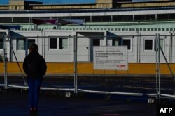 FILE - Temporary housing units for refugees are seen at the former Tempelhof airport in Berlin, Germany, Dec. 04, 2017.