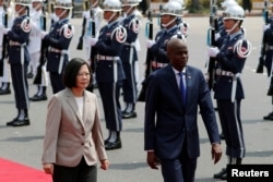 Taiwan's President Tsai Ing-wen and Haiti's President Jovenel Moise review the honor guard at a welcoming ceremony, in Taipei, Taiwan, May 29, 2017.