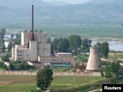 FILE - A North Korean nuclear plant is seen before demolishing a cooling tower (R) in Yongbyon, in this photo taken June 27, 2008 and released by Kyodo.