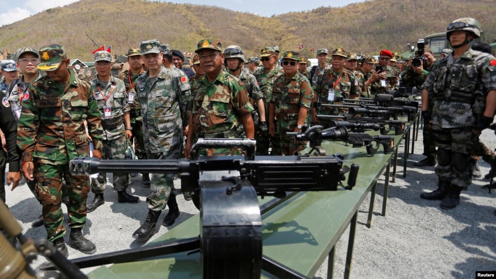 Major General Zhang Jian, commander of the Chinese People's Liberation Army Southern Theatre Command, and Pol Saroeun, commander-in-chief of the Cambodian military, attend the opening of military exercise in Kampong Speu province, Cambodia, March 17, 2018