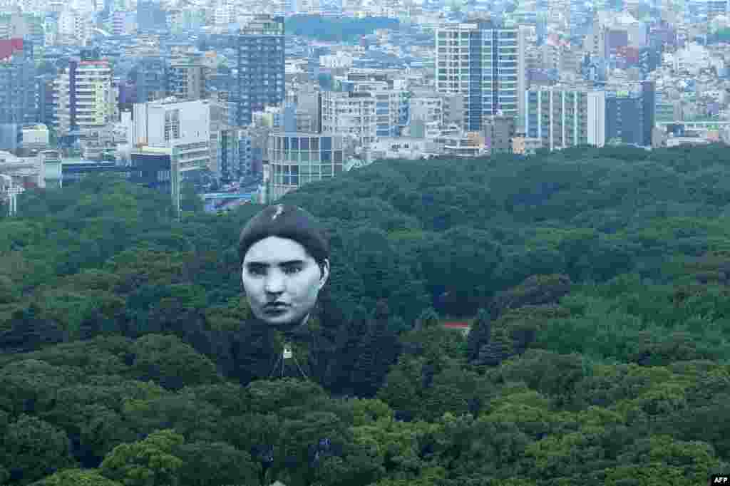 A hot air balloon created by Japanese art group "mé" as part of a project called "Masayume" — a Japanese word for a dream that becomes reality — floats over Tokyo’s Yoyogi Park.