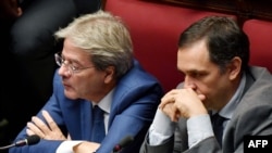 Former Italian prime minister Paolo Gentiloni (L) attends on September 9, 2019 the new government confidence vote at the lower house of parliament in Rome. 