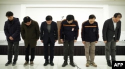 Jeju Air CEO Kim E-bae (3rd-R) and other executive members bow in apology ahead of a briefing in Seoul, South Korea, Dec. 29, 2024,