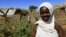 Khadieja Omer Mohamed, a 4th grader at Sudan Aid School at Dereige camp for the internally displaced poses for a photograph in Nyala in South Darfur, Sudan, Nov. 19, 2015. 