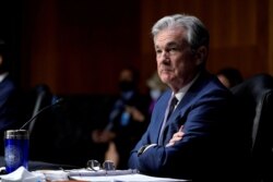 FILE - Chairman of the Federal Reserve Jerome Powell, during a Senate Banking Committee hearing, Dec. 1, 2020.