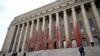 A view of the Parliament House of Finland after it was partially covered with red paint, during a protest to object peat collection by Neova company and to demand political action, in Helsinki, Sept. 25, 2024. (Lehtikuva/Emmi Korhonen via Reuters) 