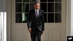 FILE - President Barack Obama walks down the White House Colonnade from the main residence to the Oval Office, in Washington, Nov. 9, 2016.