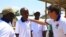  Dr. Maurice Kakule Muchunga, second left, one of several health workers who was infected with Ebola and survived, is photographed with colleagues, in Beni, Democratic Republic of Congo, Aug. 30, 2018.