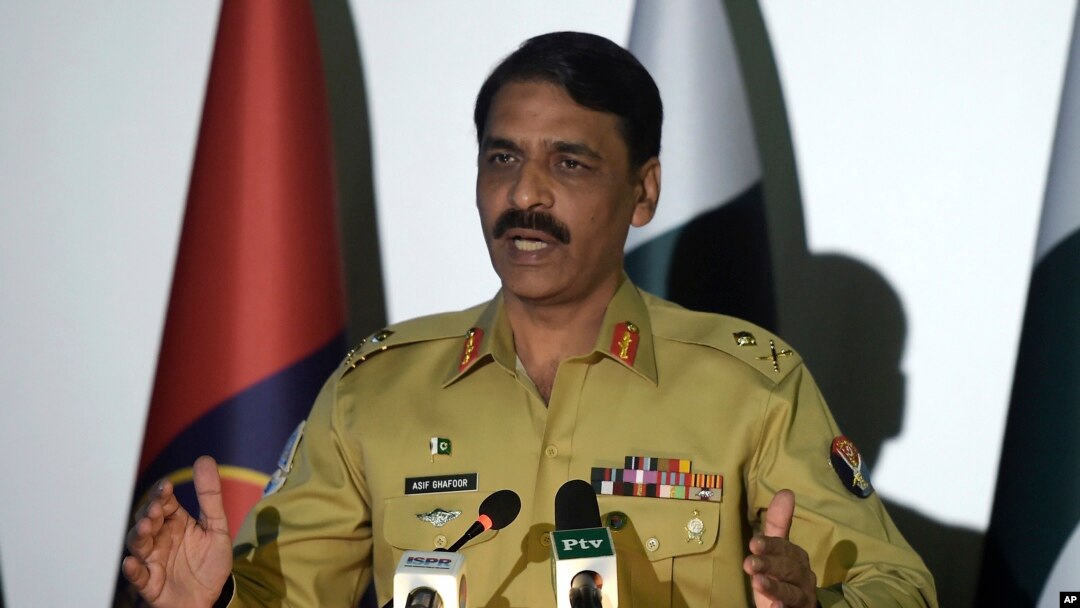 FILE - Pakistan army spokesman Maj. Gen. Asif Ghafoor, pictured in Rawalpindi in 2017, said Feb. 22, 2019, that two army officers were in custody on charges of espionage. He did not identify them.