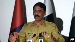 FILE - Pakistan army spokesman Maj. Gen. Asif Ghafoor, pictured in Rawalpindi in 2017, said Feb. 22, 2019, that two army officers were in custody on charges of espionage. He did not identify them.