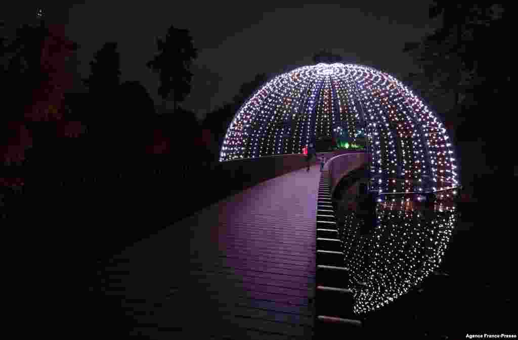 Lights brighten up the Sackler Crossing during a photocall at Kew Gardens in southwest London, ahead of the &quot;Christmas at Kew&quot; light show event.