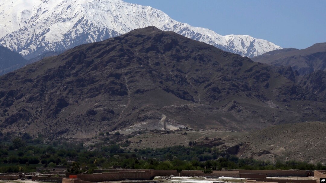 FILE - Smokes rises from the area during an operation near the area bombed by U.S. forces in the Achin district of Jalalabad, east of Kabul, Afghanistan, April 14, 2017. 