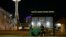 Dave Chung, who says he has been homeless for five years on the streets of California and Washington state, eats a meal before bedding down in a bus shelter in view of the Space Needle in Seattle, Oct. 30, 2017. 