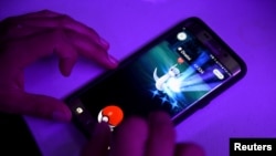 FILE - A Russian blogger, charged with enticing religious hatred for playing 'Pokenmon GO' in a church, has filed an appeal.