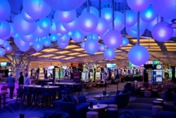 Lights hang from the ceiling at Gatsby's Cocktail Lounge in Resorts World Las Vegas, June 23, 2021, in Las Vegas. The hotel-casino on the Las Vegas Strip opened June 24.