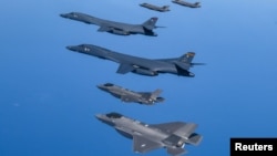 FILE - US Air Force B-1B bombers, F-16 fighter jets and South Korean Air Force F-35A take part in a joint air drill, South Korea, March 19, 2023.