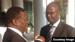 Higher Education Minister Professor Jonathan Moyo and Vice President Emmerson Mnangagwa.