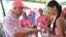 Soledad's Mayor Joao Herrera (L)  gives a woman, condoms and kits with insect repellent during a campaign to fight the spread of Zika virus in Soledad municipality near Barranquilla, Colombia, in this Feb. 1, 2016 handout photo supplied by the Soledad Mun