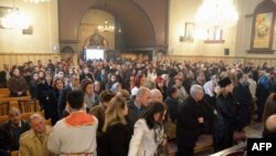 FILE - Armenian Orthodox worshippers attend a Christmas service at the Holy Mother of God Armenian Orthodox Church on Jan. 6, 2016 in the northern Syrian city of Aleppo. 