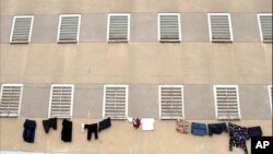 Clothes hang from an Iranian Prison. In Iran more than 116 Baha’is are in prison for teaching and expressing their faith, and many Christians, Sufis and Sunnis are facing similar treatment. 