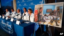 A photo of an unidentified patient whose lungs were irreparably damaged from vaping is displayed while medical staff at Henry Ford Hospital answer questions during a news conference in Detroit, Nov. 12, 2019. 