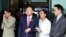 FILE - Former Thai Prime Minister Thaksin Shinawatra walks with his son Panthongtae Shinawatra and daughters Paetongtarn Shinawatra and Pintongtha Kunakornwong at Don Mueang airport in Bangkok, Thailand August 22, 2023. 