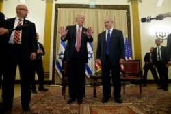 FILE - President Donald Trump talks to reporters before a meeting with Israeli Prime Minister Benjamin Netanyahu, May 22, 2017, in Jerusalem.