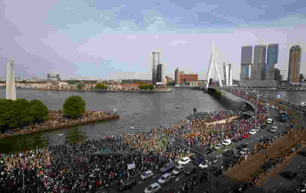 Thousands of people line Erasmus bridge as they take part in a demonstration in Rotterdam, Netherlands, to protest against the recent killing of George Floyd, police violence and institutionalized racism.