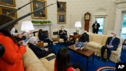 President Joe Biden, accompanied by Vice President Kamala Harris and Treasury Secretary Janet Yellen, meets with business leaders to discuss a coronavirus relief package in the White House, Feb. 9, 2021.