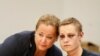 Philip Manshaus, with black eyes and wounds on his face and neck, appears with his lawyer Unni Fries in court in Oslo, Norway. Manshaus, 21, is suspected of an armed attack at Al-Noor Islamic Centre Mosque and killing his stepsister.