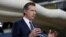 FILE — Gov. Gavin Newsom discusses the acquisition of the Sleep Train Arena for use as a field hospital, after touring the facility, in Sacramento, California, April 6, 2020.