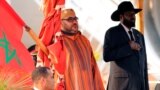 King Mohammed VI of Morocco, left, and South Sudan's President Salva Kiir stand for the national anthem after he arrived at the Juba airport in South Sudan's capital Juba, Feb. 1, 2017. 