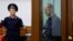 FILE - Wall Street Journal reporter Evan Gershkovich, who stands trial on espionage charges, reacts inside an enclosure for defendants before a court hearing in Yekaterinburg, Russia, June 26, 2024.