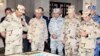 FILE - A handout picture released by the Egyptian Presidency Feb. 25, 2018, shows Egyptian President Abdel Fattah el-Sissi (R), dressed in uniform, during a visit to a regional military headquarters at an undisclosed location. 