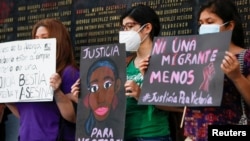FILE - Women protest the death of Victoria Salazar Arriaza, a Salvadoran woman who died in Mexican police custody, in San Salvador, El Salvador, March 29, 2021.