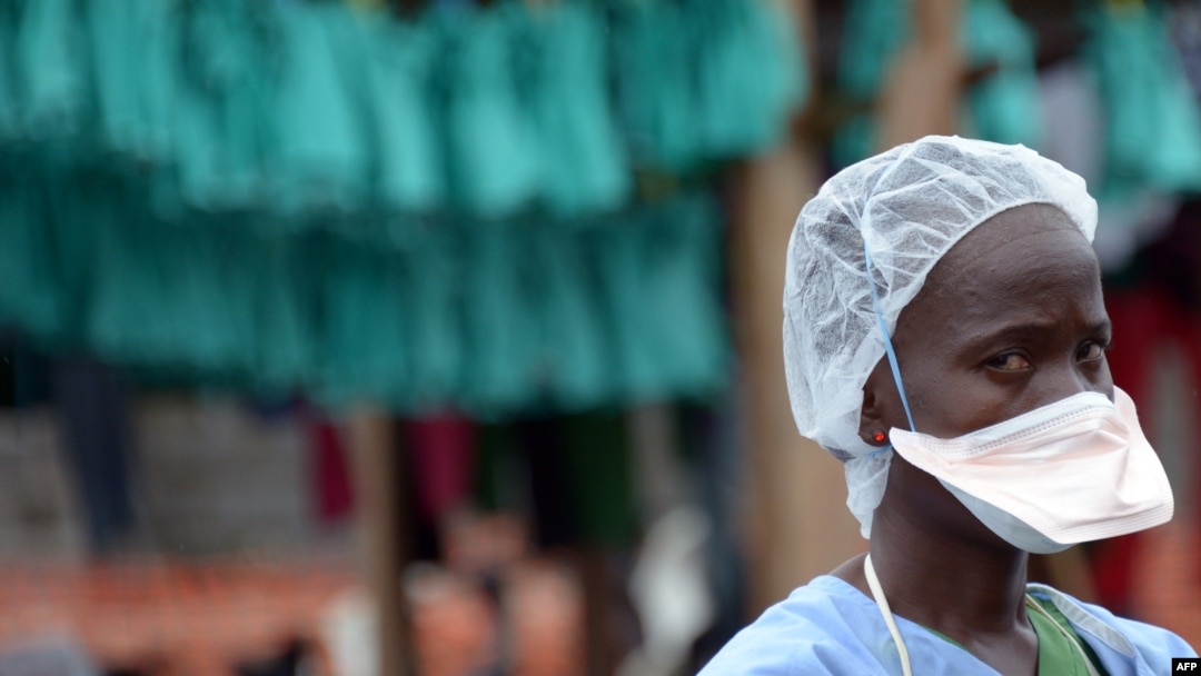 FILE - A health worker stands at Elwa hospital in Monrovia, Sept. 7, 2014. The facility is run by Medecins Sans Frontieres (Doctors without Borders). 