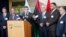 U.N. representative for Libya, Bernardino Leon, center, addresses reporters while Libyan parliaments members listen in Rabat, Morocco,  Sept. 18, 2015..