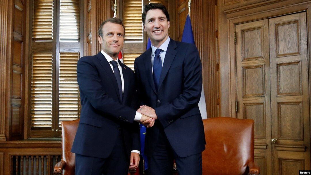 Canada's Prime Minister Justin Trudeau shakes hands with French President Emmanuel Macron during a meeting in Trudeau's office on Parliament Hill in Ottawa, Ontario, Canada, June 6, 2018.