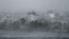 High winds whip water onto the shore of Phuong Luu Lake as Typhoon Yagi hits Hai Phong, Vietnam, on Sept. 7, 2024. Yagi uprooted thousands of trees and swept ships and boats out to sea as it made landfall, state media said.